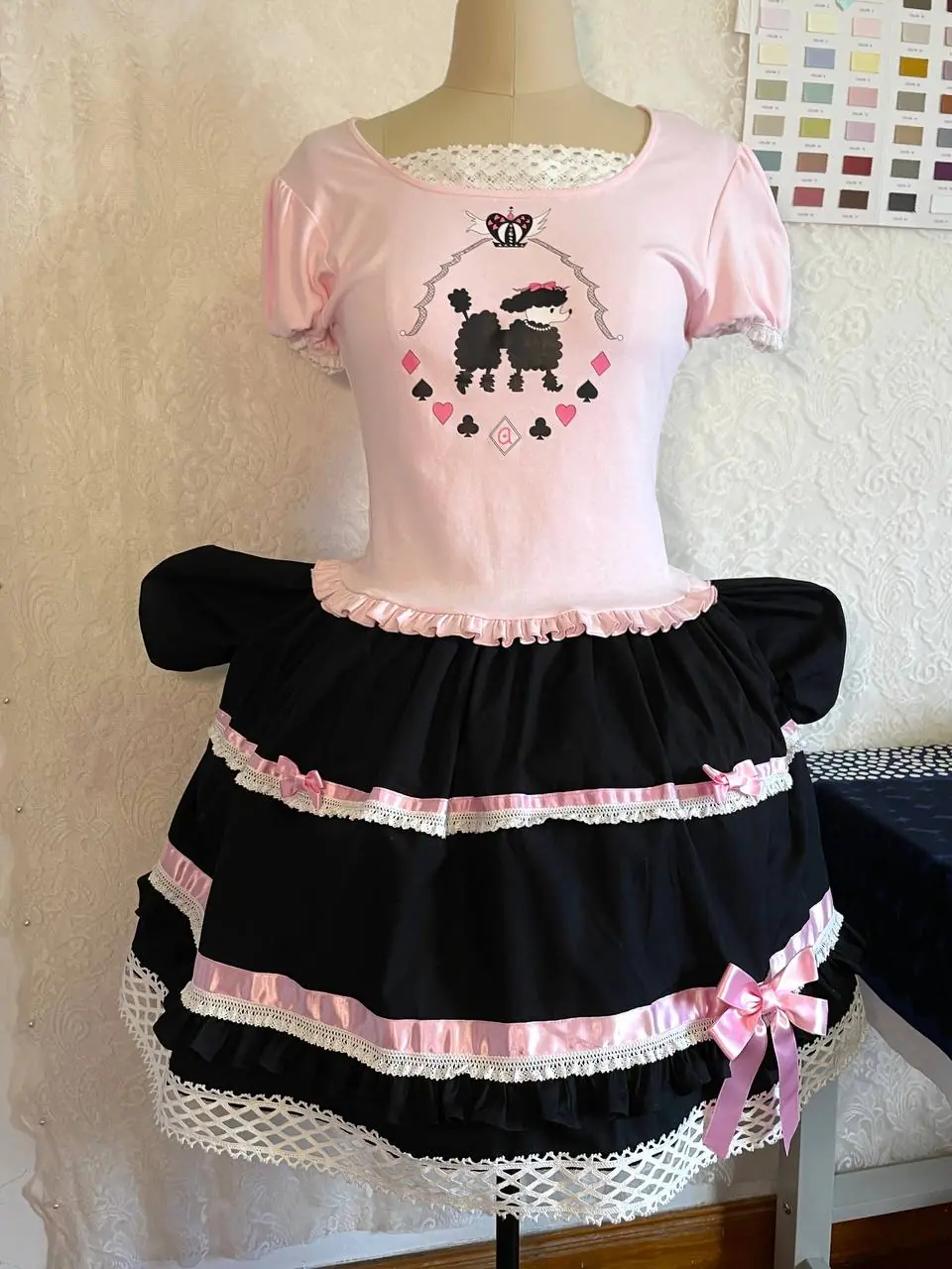 Poodle Poker, pink and black, from the side